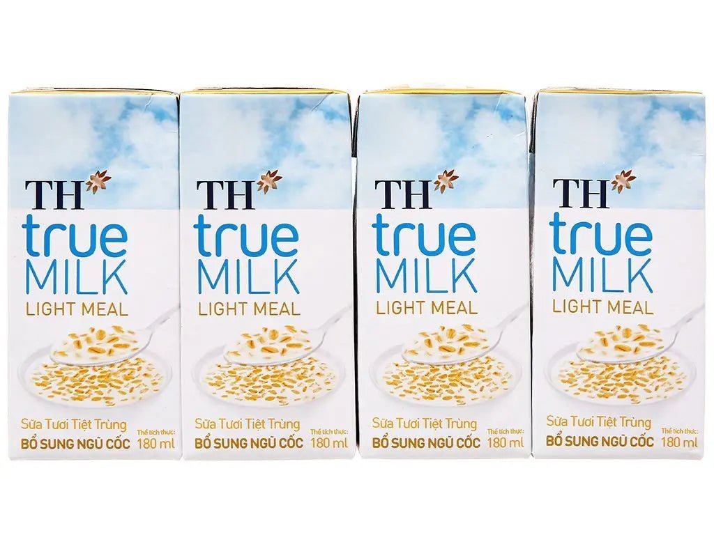 Four cartons of TH true milk light meal, 180ml, with cereal, front view on white background